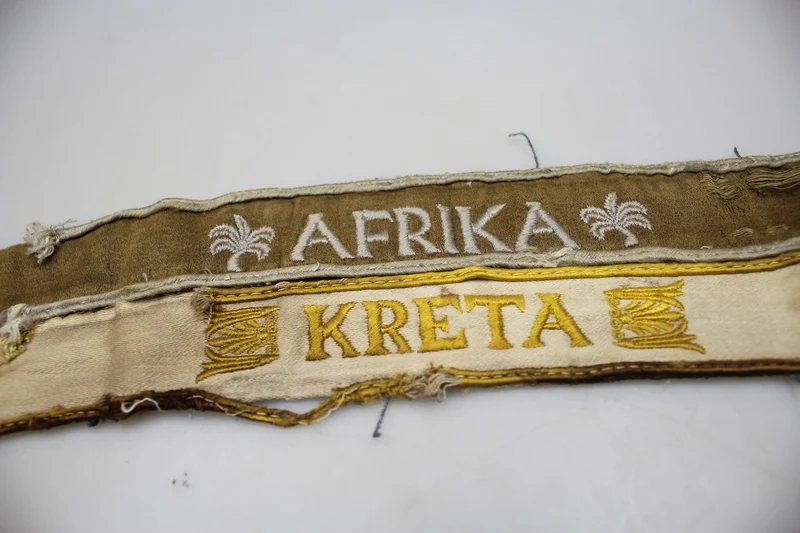 Paar kretische und afrikanische WH-Armbänder aus dem Zweiten Weltkrieg