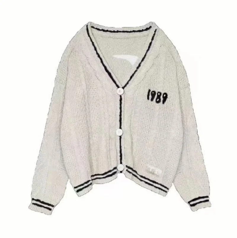 Damen nan kurz geschnittene Strickjacke mit V-Ausschnitt, Kontrastpaspel und oversized Ärmeln Drune