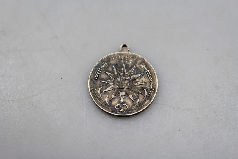 Carlsberg-Medaille mit Hakenkreuz