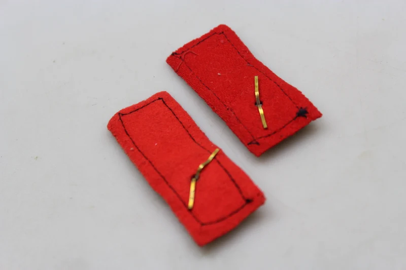 Paar offizielle REI-Insignien aus dem 2. Weltkrieg