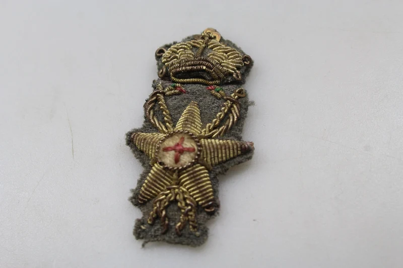 Offizielles Emblem des Gesundheitsdienstes von REI im Zweiten Weltkrieg