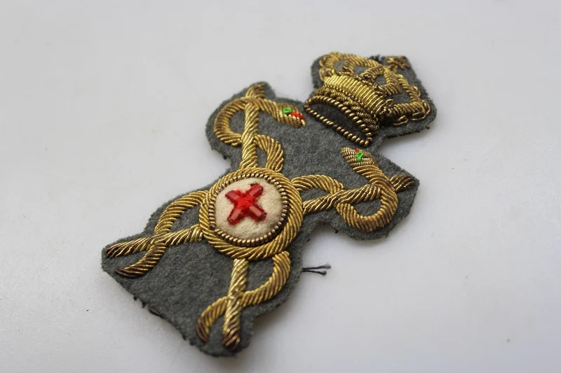 M.34 REI Apotheker-Offiziersmütze Emblem