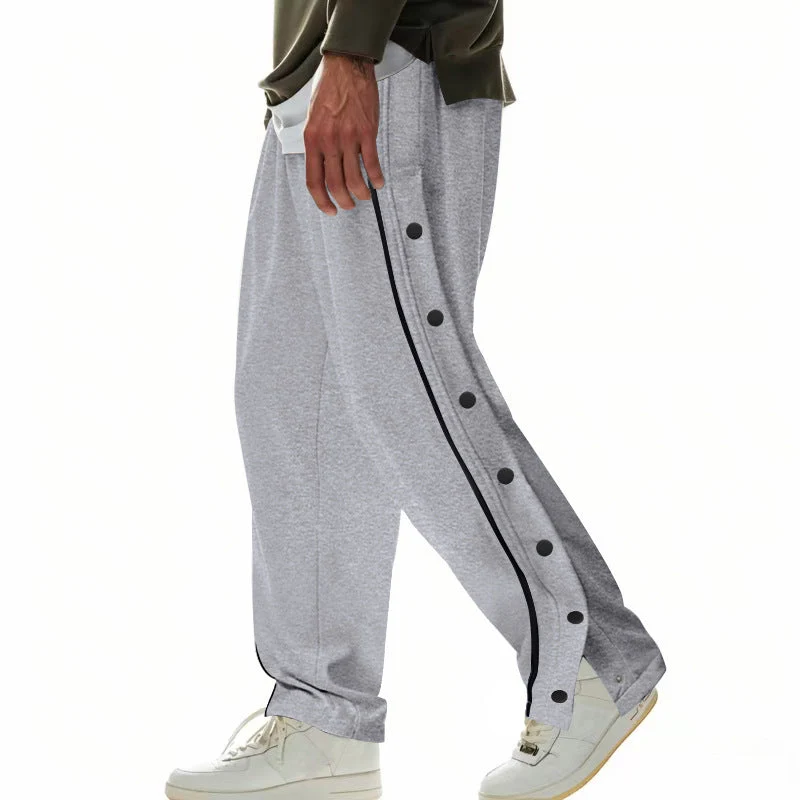 Herren nan weite Trackpants mit seitlicher Druckknopfleiste, elastischem Bund und reflektierendem Streamline-Streifen Drune